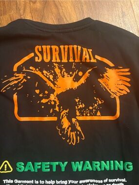 Men's Black Graphic Sweatshirt with Orange Eagle and Green 'Safety Warning' Text